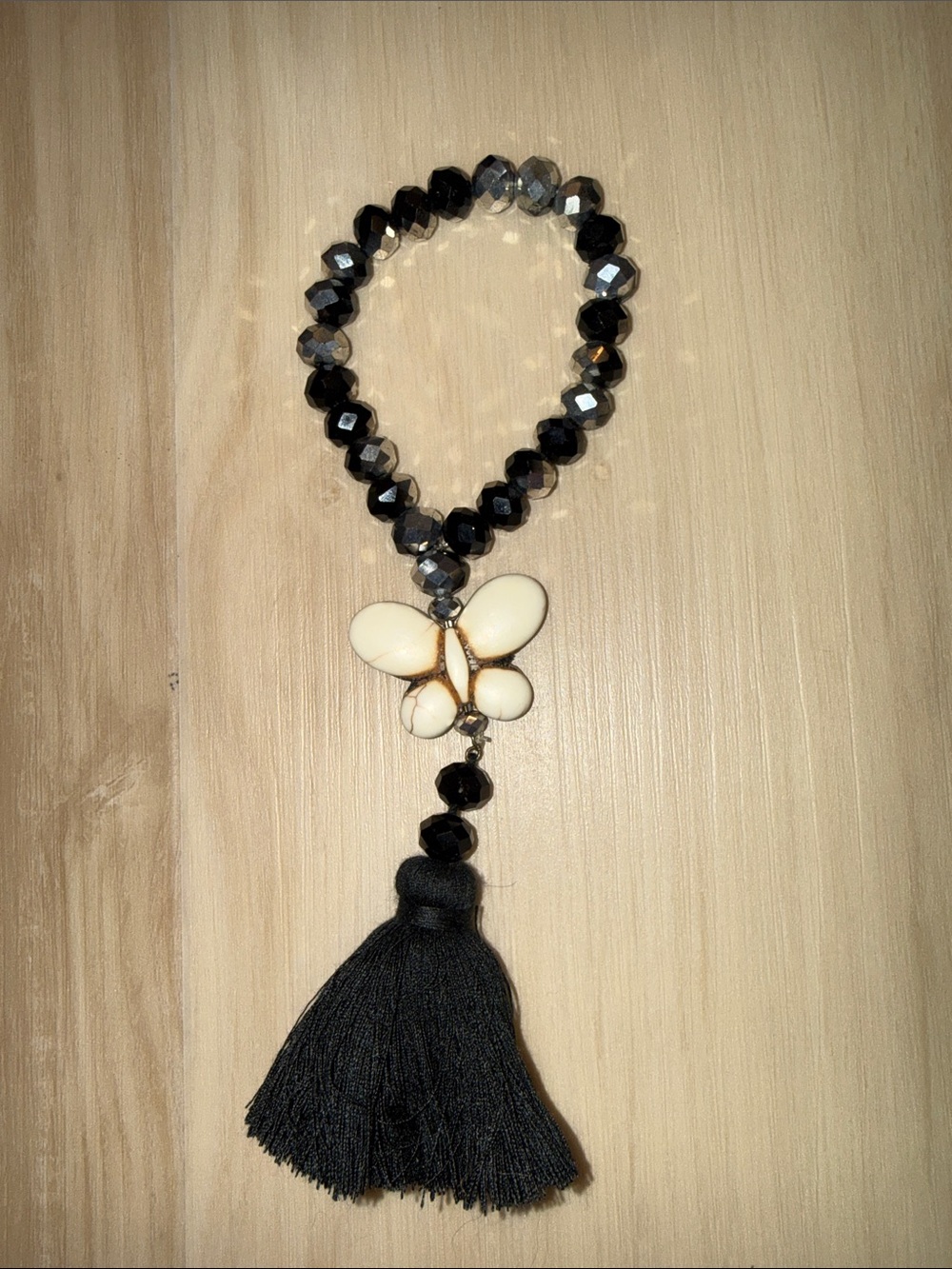 Black and silver Beaded Bracelet with Cream Butterfly and Tassel